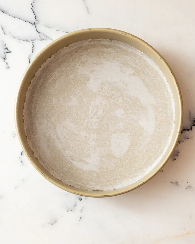 Line cake pan with parchment paper