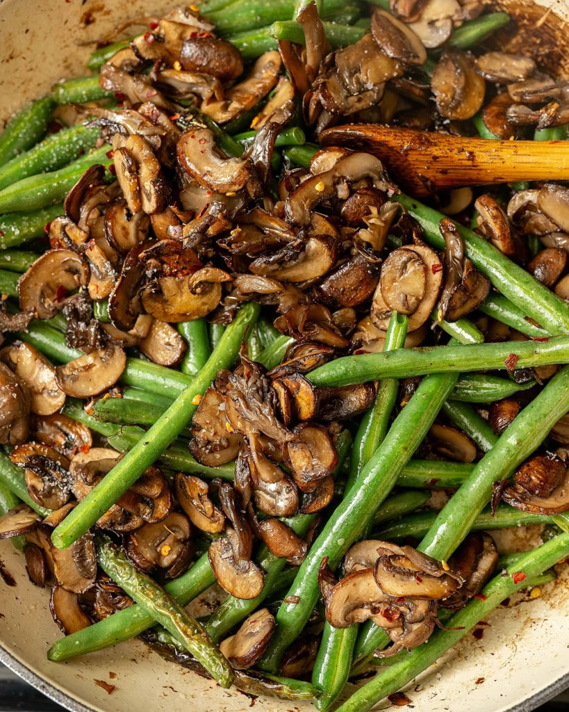 Return mushrooms to skillet