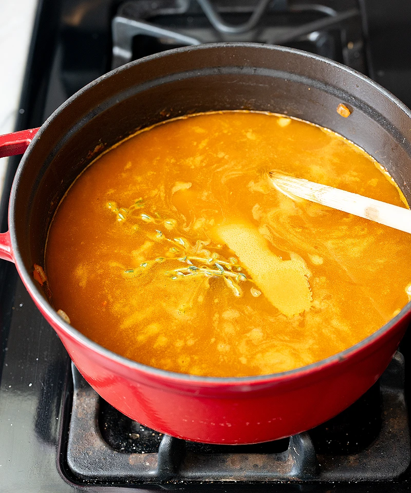 Simmer orange thyme bean soup