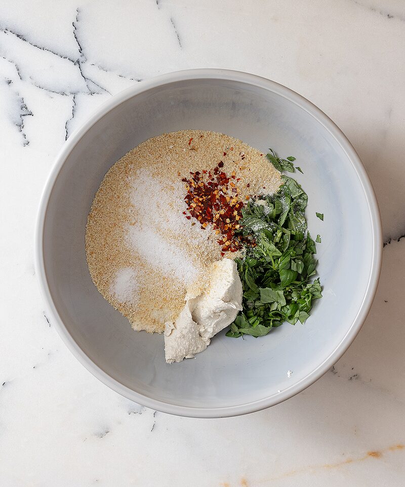 Add breadcrumbs vegan ricotta cheese to basil