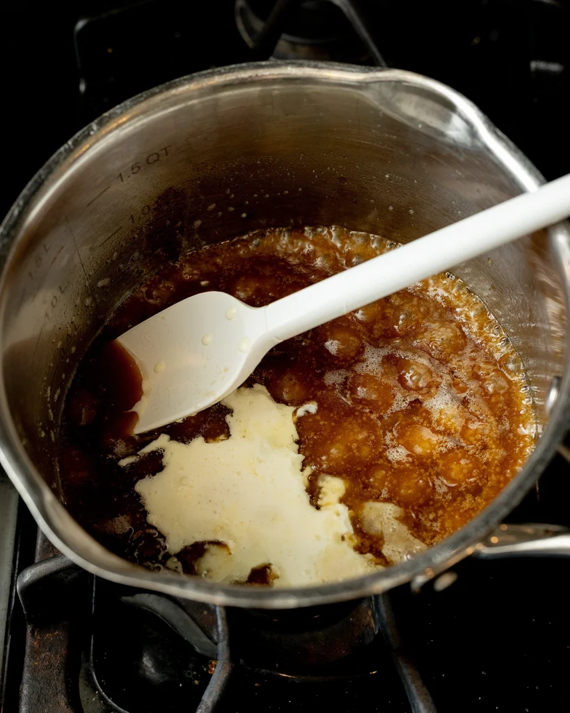 Add cream to caramel