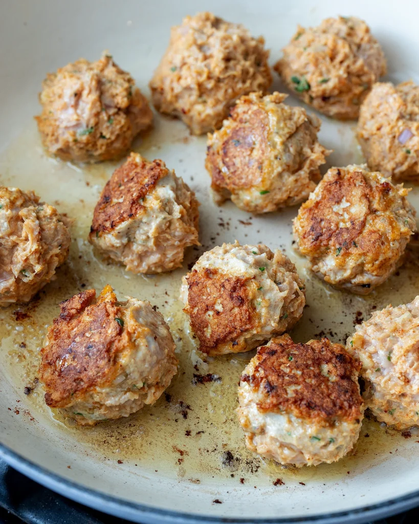 Fry harissa chicken meatballs until brown