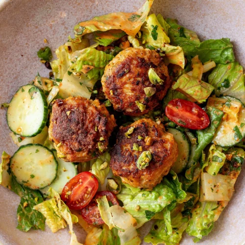 Harissa chicken meatball salad with pistachios