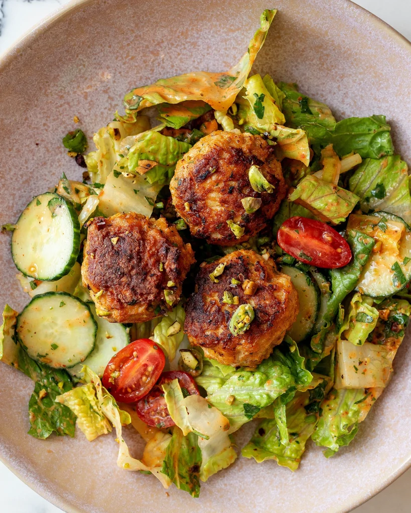 Harissa chicken meatball salad with pistachios