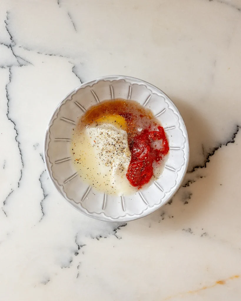 Prepare the creamy harissa honey dressing