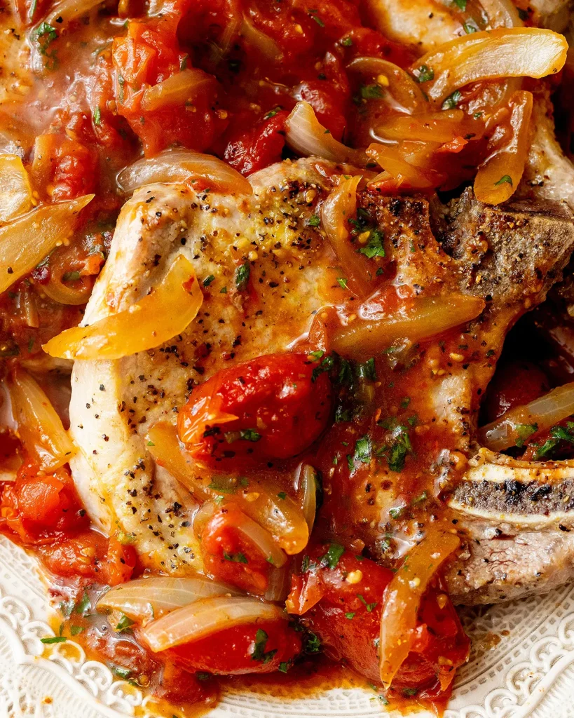 Lemon pepper pork chops with tomatoes