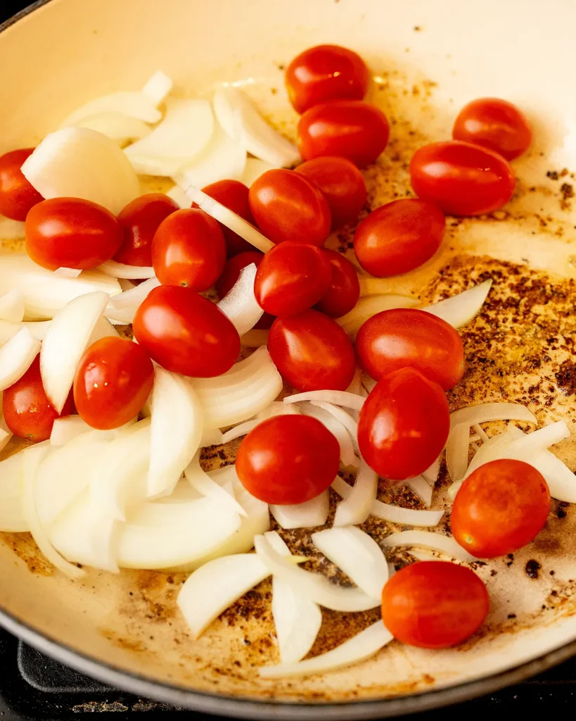 Saute tomatoes and onions
